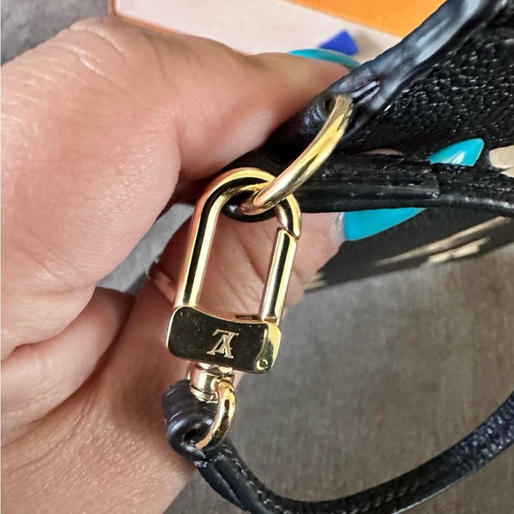 Louis Vuitton Black Clutch with Iconic LV Logo and Decorative Floral Elements - Picture 4 of 6